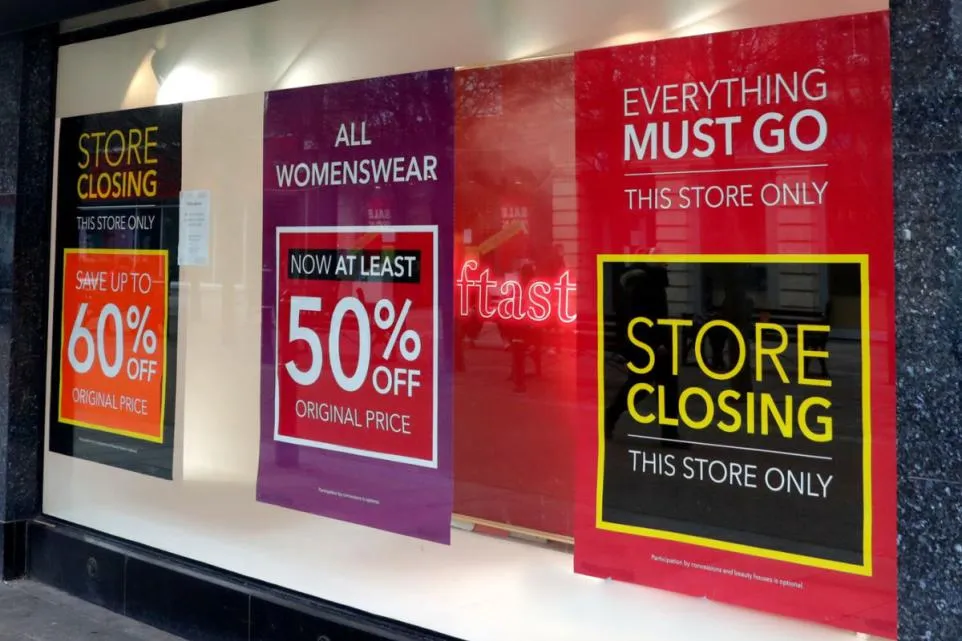 A closed high-street fashion store front